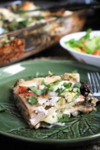 Slice of veggie lasagna and a side salad