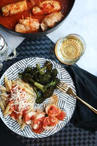 Chicken Scaloppine with Sage and Fontina Cheese served with white wine.