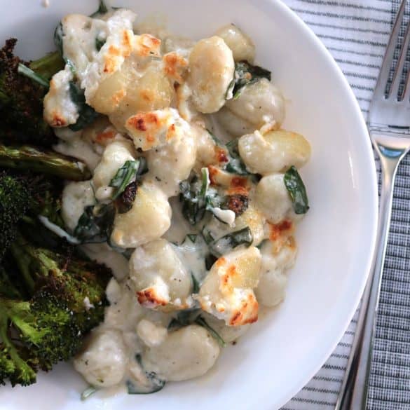 Gnocchi with Goat Cheese and Spinach in a Bowl with Roasted Broccoli.