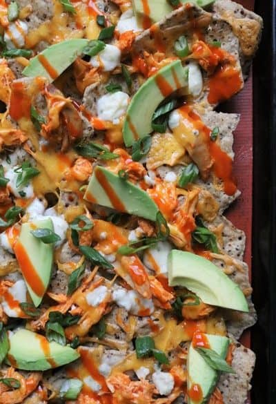 Sheet pan of baked buffalo chicken nachos