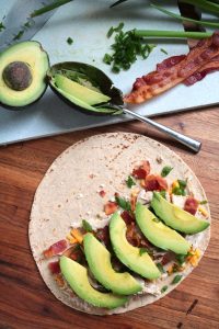 Assembling Cheesy Chicken, Bacon & Avocado Quesadillas.