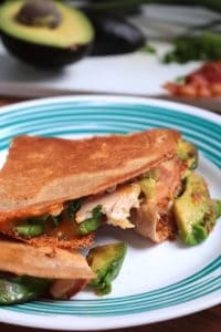 Cheesy Chicken, Bacon & Avocado Quesadillas on a plate.