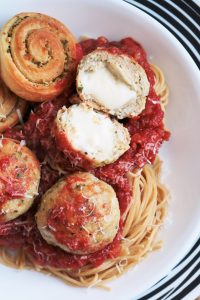 Baked Chicken Parmesan Meatballs Stuffed with Mozzarella.