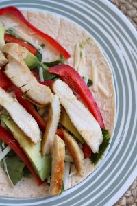 Assembling a Caramelized Honey Mustard Chicken Wrap.