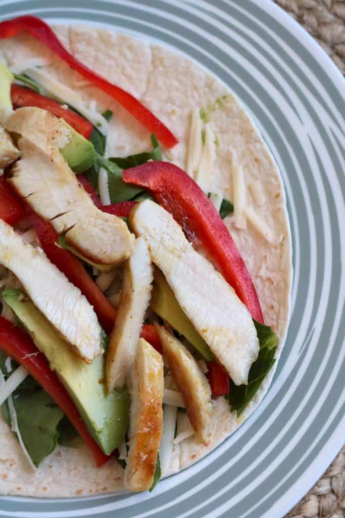Assembling a Caramelized Honey Mustard Chicken Wrap.
