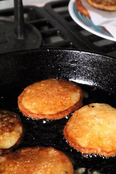 Corn Fritters cooking in a Cast Iron Skillet