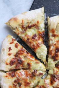 Tomato-Pesto Pizza with Basil and Goat Cheese Stuffed Crust Slice