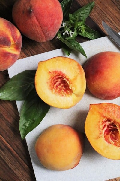 Halved Peaches and Basil