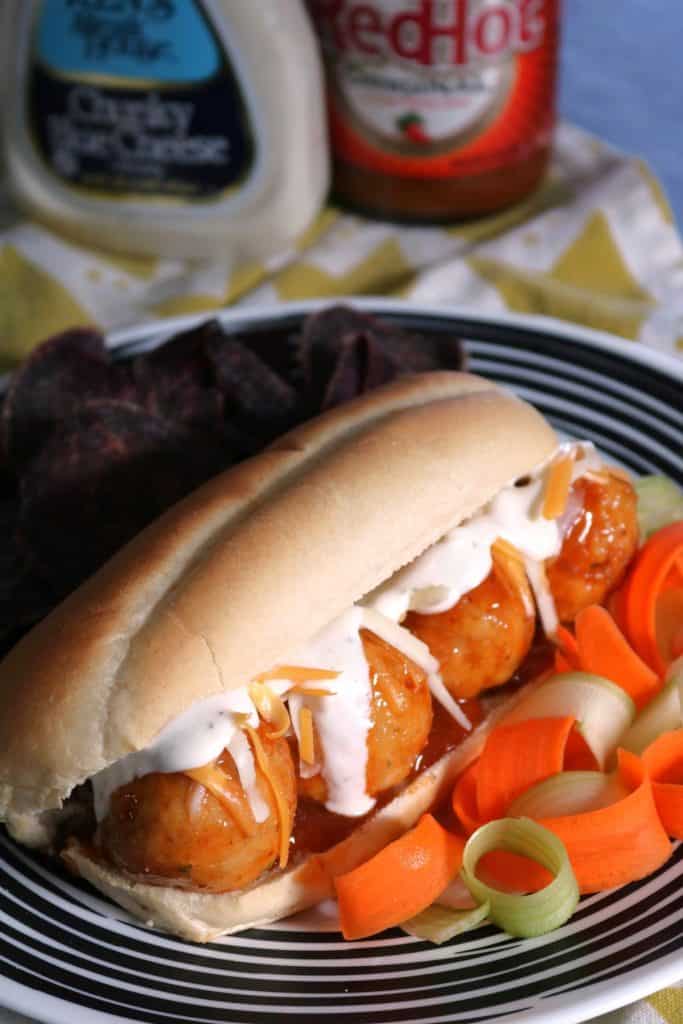 Buffalo Chicken Meatball Subs with chips.