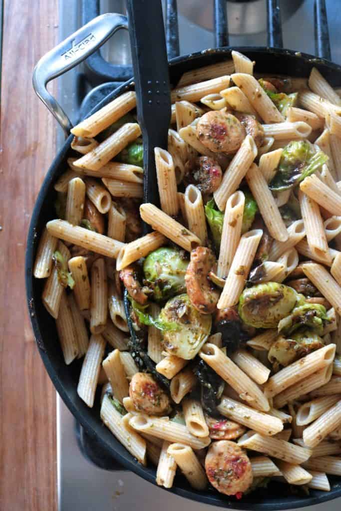 Pesto Pasta with Chicken Sausage & Roasted Brussels Sprouts in a Skillet.