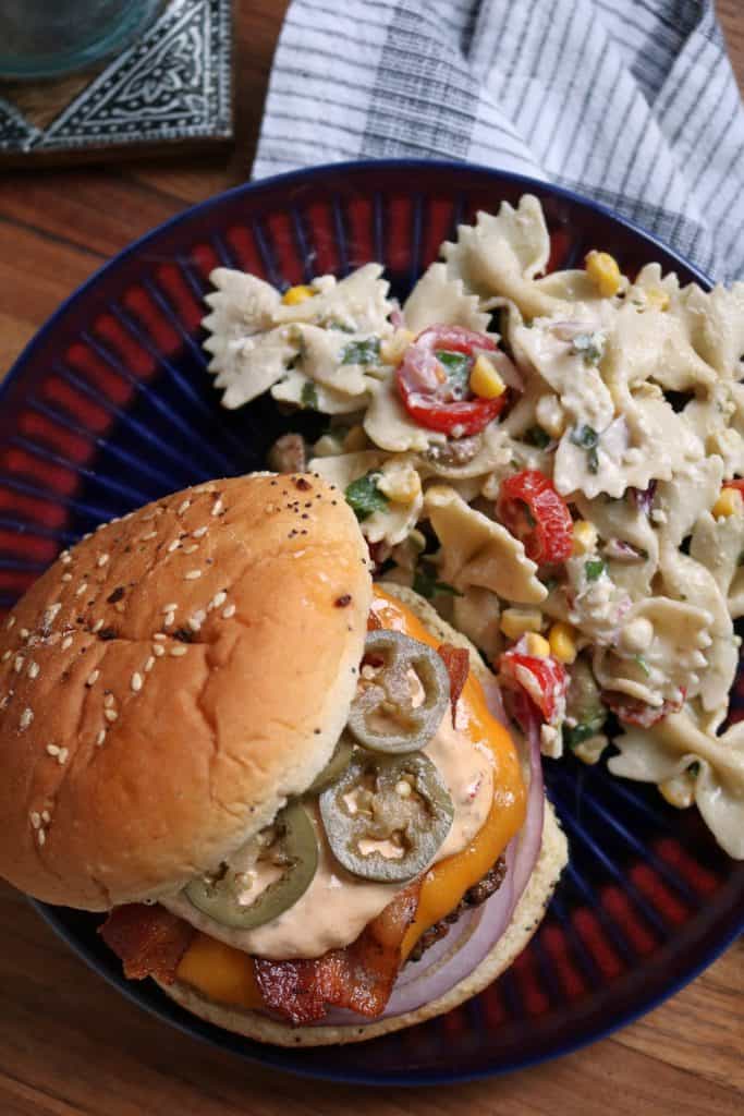 Bacon Jalapeno Burgers with Chipotle Sauce and a side of Pasta Salad.
