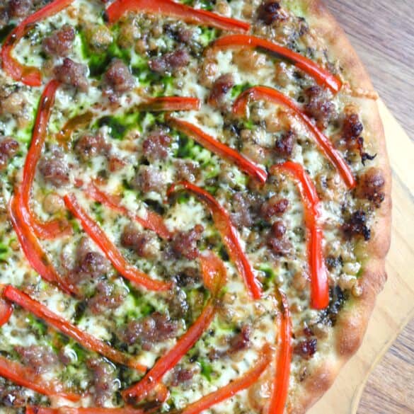 Sausage, Red Bell Pepper, and Spinach Pesto Pizza.