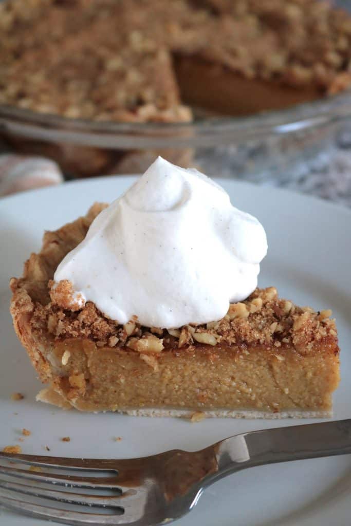 Pumpkin Pie with Brown Sugar-Walnut Topping and Fresh Whipped Cream.