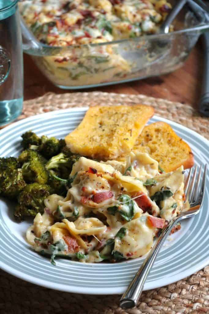 Tortellini Spinach Bake in Creamy Meyer Lemon Sauce with Garlic Bread on the side.