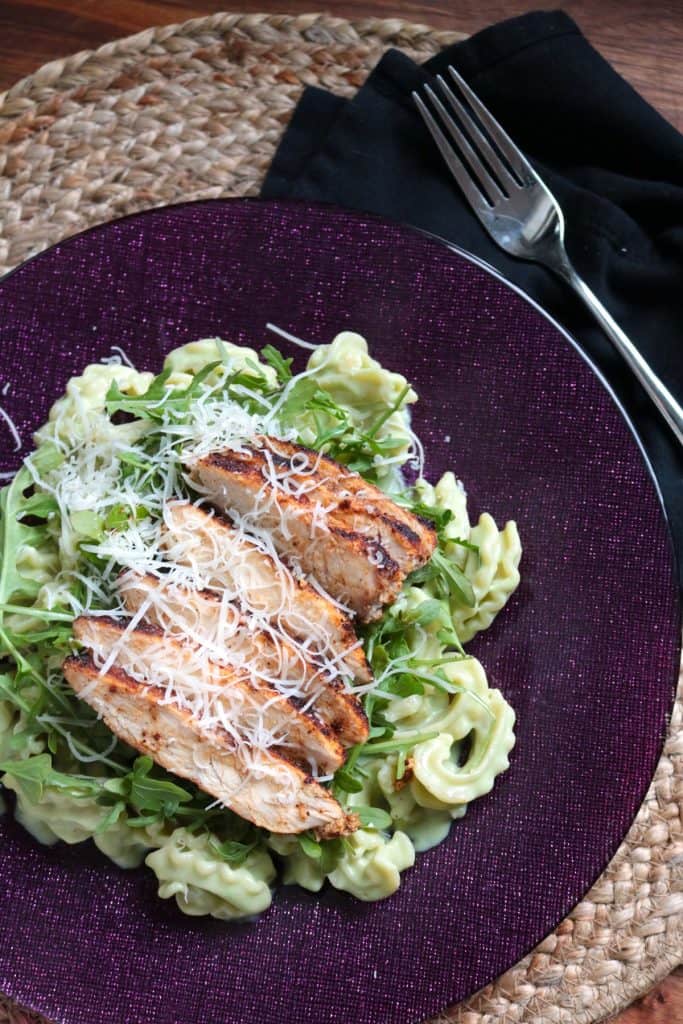 Lighter Avocado Alfredo Pasta with Spicy Chicken on a plate.