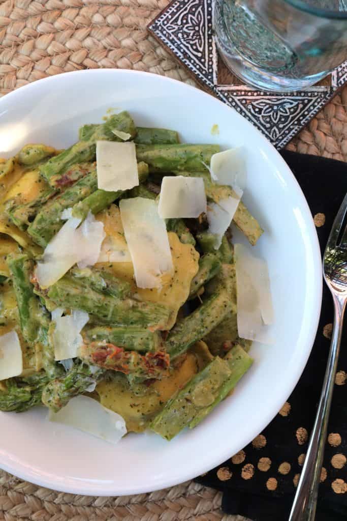 Creamy Pesto with Ravioli, Asparagus and Sun Dried Tomatoes.
