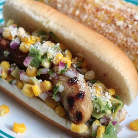 Mexican Hot Dogs with Corn Salsa and Chipotle Cream.