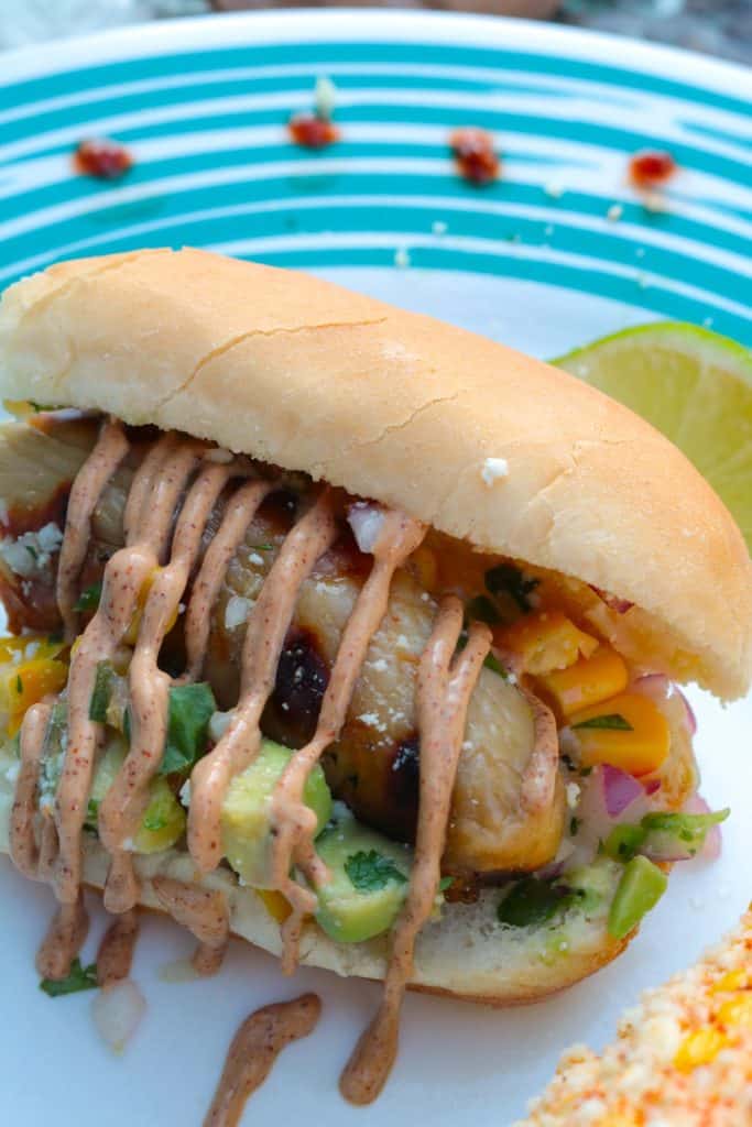 Mexican Hot Dogs with Corn Salsa and Chipotle Cream.