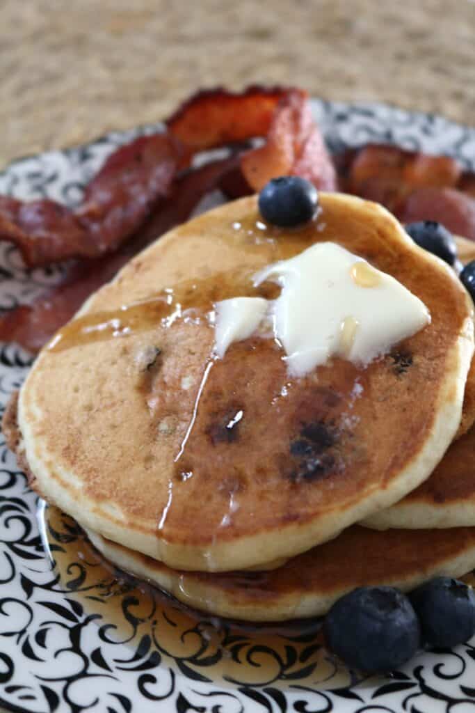 Blueberry-Flax Buttermilk Pancakes with butter and syrup.