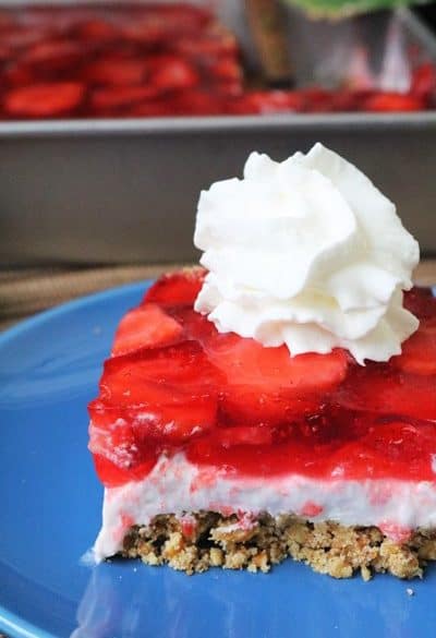 Strawberry Pretzel Salad topped with whipped cream