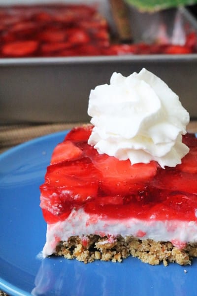 Strawberry Pretzel Salad topped with whipped cream