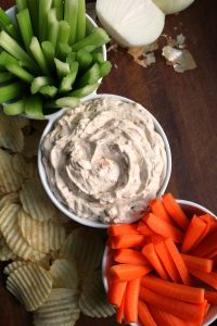Caramelized Onion Dip with Celery and Carrots.
