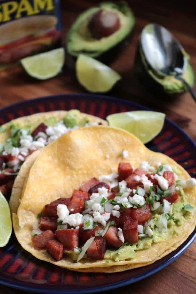 SPAM Tacos with avocado, onion, cilantro, and queso fresco.
