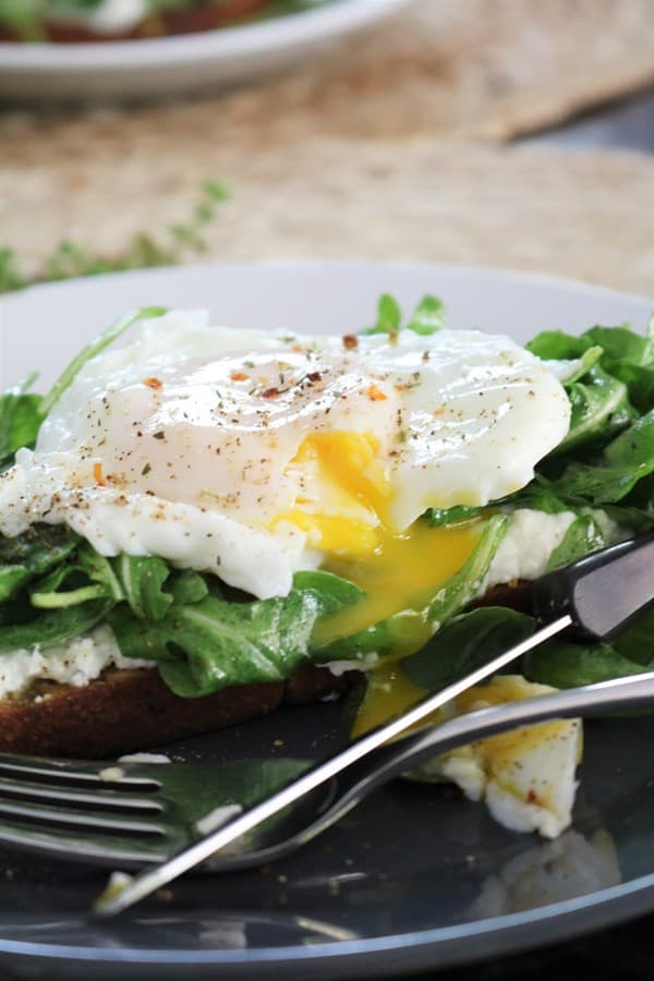 Ricotta Toast with Arugula and a Poached Egg.
