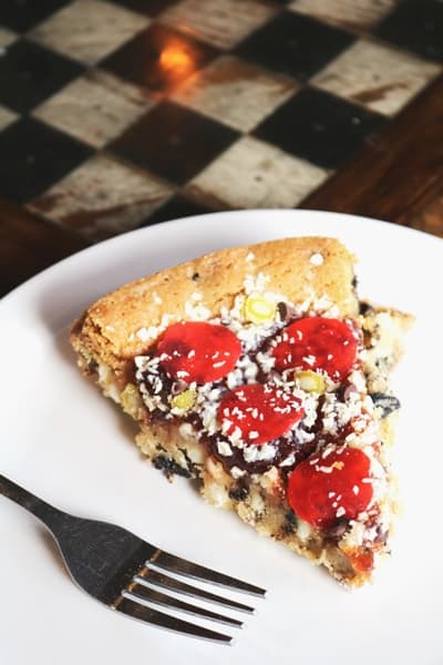 A slice of Pizza Cookie Cake on a plate.