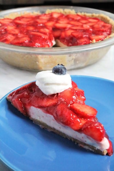 No-Bake Strawberry Cheesecake Pie Slice with Whipped Cream