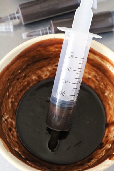 Filling a Syringe with Chocolate Pudding