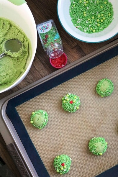 Rolling out dough to make Grinch Heart Thumbprint Cookies #anolon #sweetssquad