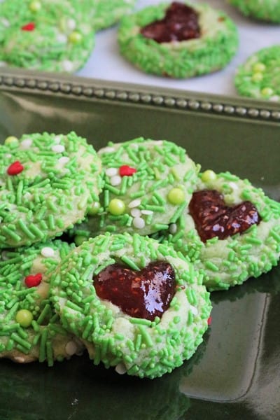 Green Grinch with Red Jam Heart Thumbprint Cookies