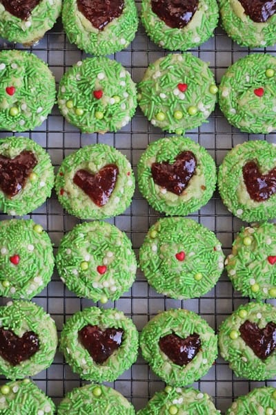 Grinch Heart Thumbprint Cookies cooling on a wire rack