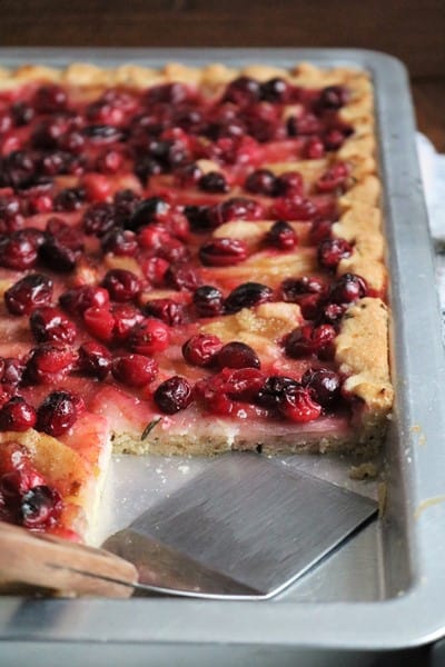 Pear Cranberry Slab Pie with Rosemary Sugar Cookie Crust with slice removed