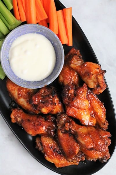 Slow Cooker Honey‌ ‌Buffalo‌ ‌Wings with blue cheese, carrots, and celery