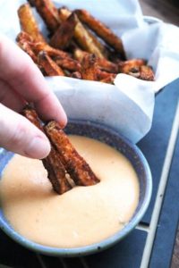 Baked Nacho Fries dipped in Nacho Cheese
