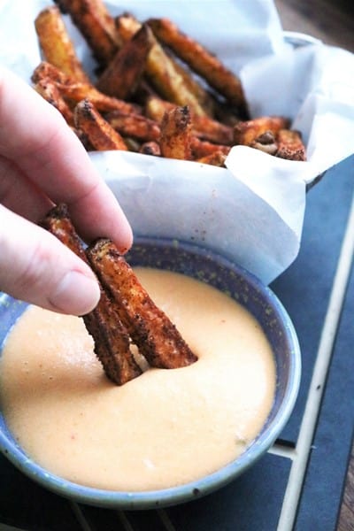 Baked Nacho Fries dipped in Nacho Cheese