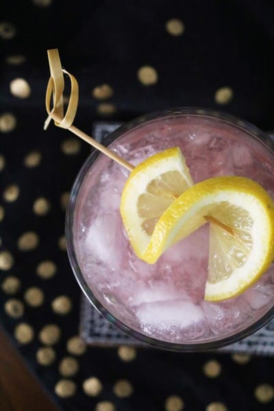 Lunar Bramble Cocktail garnished with a lemon