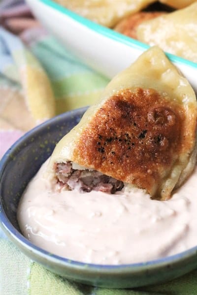 Corned beef pierogi dipped in Thousand Island Dressing