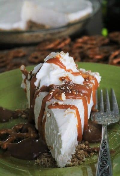 Slice of Irish Cream Pie with a pretzel crust and topped with whiskey caramel