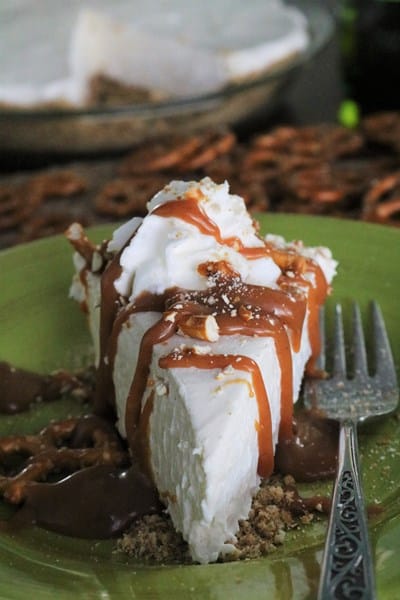 Slice of Irish Cream Pie with a pretzel crust and topped with whiskey caramel