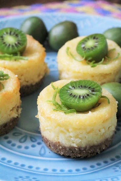 Coconut Key Lime Mini Cheesecakes topped with Kiwi Berries