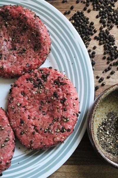 Burger coated in black peppercorns