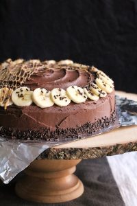 Anna Banana Cake on a wood cake stand