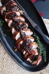 Sliced Black Pepper Pork Tenderloin topped with Fig Preserves.