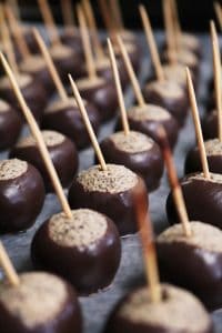 Chocolate Dipped Buckeyes on Toothpicks.