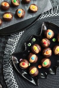 Monster Cookie Buckeyes on a bat plate.