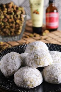 Rosewater Pistachio Snowball Cookies on a Plate.