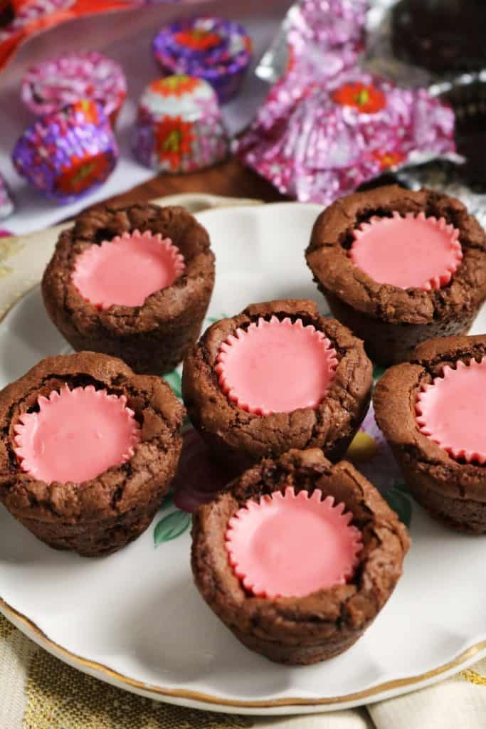 Six Mini Peanut Butter Cup Brownies on a plate.